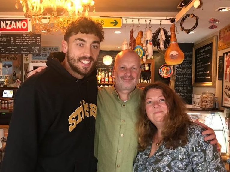 Football player Matt Crooks with Joanne and Andrew, Peter's parents